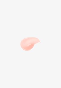 Light pink cosmetic cream smear with smooth texture on a white background.
