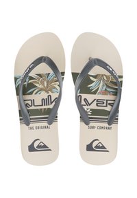 Infradito beige con cinturini grigi che presentano un design verde e floreale. Il testo include "The Original" e "Surf Company" al centro.