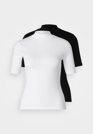Set of two fitted turtleneck tops in white and black. Short sleeves, smooth cotton fabric, and close-fitting design. No patterns or graphics.