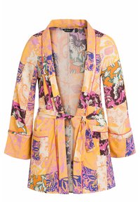 Kleurrijke gewatteerde jurk met lange mouwen, in gele, paarse en oranje tinten. Bevat een riem, zakken en ingewikkelde bloemmotieven.