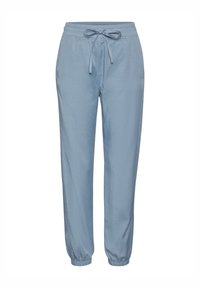 Vaaleansiniset juoksuhousut, jotka on valmistettu pehmeästä kankaasta. Housuissa on joustava vyötärö ja säädettävä naru, sekä kapenevat hihansuut ja rento istuvuus.