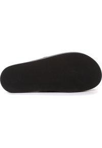 Suola di scarpa nera con una superficie liscia e piatta. Bordo arrotondato e forma definita. Design semplice senza alcun motivo o accento visibile.