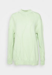Ljusgrön sweatshirt med texturerade vågmönster, hög krage och slitna detaljer längs fållen och ärmarna. Mjuk tyg.
