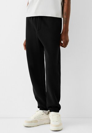 Bershka PLUSH - JOGGING - Tracksuit bottoms - black