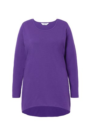 Langsleeve tuniek in levendig paars, gemaakt van een zachte stof. Heeft een ronde halslijn en een gebogen zoom voor een relaxte pasvorm.