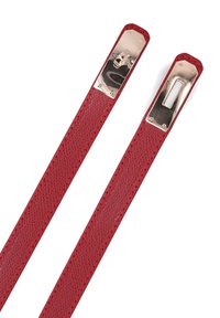 Red leather straps featuring a textured surface, flat design, and metallic hardware at each end with a rectangular cutout.