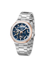 Automatisk klocka med en blå skelettonk dial, roséguld accenter, silverfärgad stainless steel-kåpa och armband, samt framträdande timmarkörer.