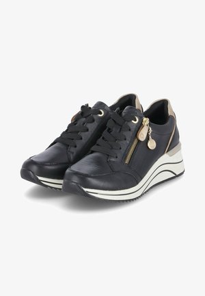 Black leather sneakers with lace-up front, side zipper, and gold hardware accents. Elevated white sole with textured black tread.