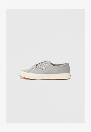 Low-cut gray canvas sneaker with white rubber sole, white laces, and a small "Superga" brand tag on the side.