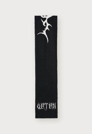 Black knitted scarf featuring a white abstract pattern and text at the bottom. The texture appears soft and medium in thickness.
