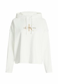 Felpa bianca con cappuccio realizzata in morbido cotone, caratterizzata da un logo frontale dorato, vestibilità comoda, maniche lunghe e polsini a coste.