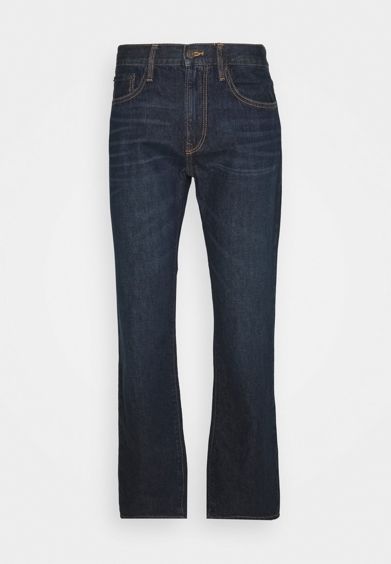 Jeans de denim azul escuro com corte reto, apresentando cinco bolsos, costura discreta e um clássico fecho zip.