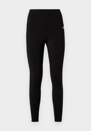 Leggings noirs avec une taille haute, une texture lisse et une coupe ajustée. Pas de motifs visibles ni de détails métalliques.