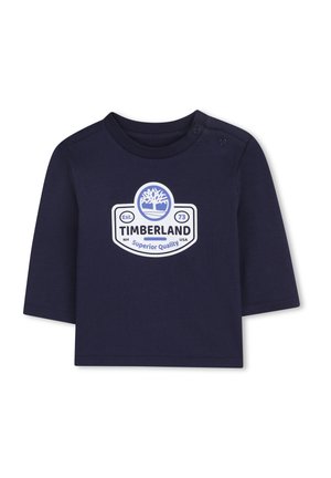 Marineblauwe lange mouwen T-shirt van katoen met een wit Timberland-logo en een boomafbeelding, voorzien van twee drukknoopjes op de schouder.