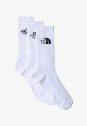 Baltos medvilninės kojinės su ribota tekstūra, ant kiekvienos kojinės juoduoju "The North Face" logotipu. Pakuotėje yra trys poros.