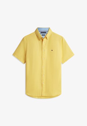 Gelbes Kurzarm-Hemd mit Knöpfen, Kragen und kleinem Tommy Hilfiger Logo auf der linken Brust.