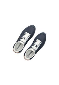Navy blue sneakers with white laces, synthetic upper, round toe, and textured rubber sole. Features logo on the side and contrasting heel.