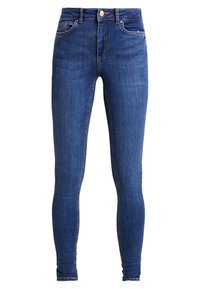 Jeans ajustados en denim azul oscuro, con una altura media en la cintura, diseño de cinco bolsillos y costuras sutiles a lo largo de las costuras.