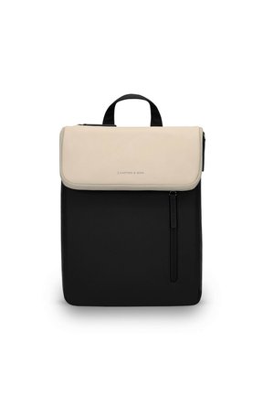 Backpack with a black base, cream-colored flap, top handle, and front zip pocket. Features subtle logo and smooth texture.