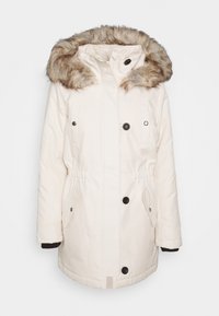 White parka jacket with fur-lined hood, two buttoned pockets, elastic waist, and black button accents. Smooth fabric with a textured hood.