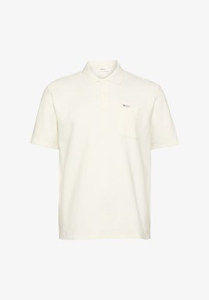 Kurzärmeliges Polohemd in Cremefarbe mit einer Brusttasche und einem kleinen Logoetikett auf der Tasche.