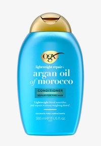 OGX lätt reparationsbalsam i en turkos plastflaska med guldlocket. Texten lyfter fram arganolja och reparation för fint hår. 385 ml.