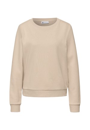 Beige väriinen pyöreäkauluksinen collegepaita, jossa on pitkät hihat, resorit hihoissa ja helmassa, esitetty valkoisella taustalla.