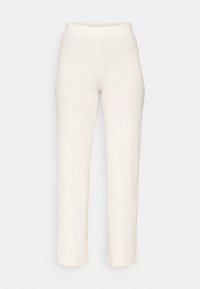 Pantaloni a coste cream con una vita aderente e gambe dritte. Il materiale ha una consistenza morbida, adatta per un abbigliamento casual.