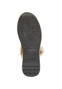Semelle en caoutchouc noir avec des motifs de rainures horizontales et verticales ; présente le logo "TOM TAILOR" et un détail de taille 40. Le design comprend un accent doux, ressemblant à de la fourrure.