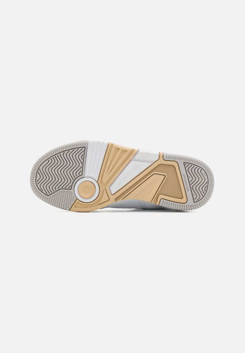 Schuhsohle mit einer strukturierten grauen Gummibasis und einem kontrastierenden Design in Beige und Weiß, das Zickzack- und Kreisformen integriert.