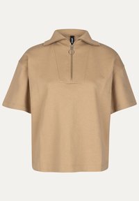 Beige poloko s krátkým rukávem vyrobené z měkké tkaniny, s polo-zip uzavíráním, špičatým límcem a obdélníkovou kapsou.