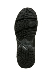 Black sneaker outsole featuring a textured rubber surface with a patterned tread for grip, and a transparent section revealing cushioning detail.