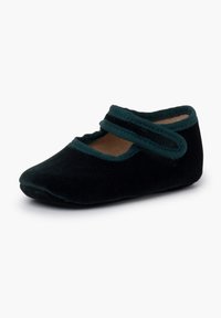 Bailarina de terciopelo negro con un ribete en verde azulado. Presenta una doble correa en la parte superior, puntera redondeada y un suave forro interior.