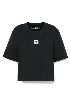 Schwarzes Baumwoll-T-Shirt mit kurzen Ärmeln, Rundhalsausschnitt und einem quadratischen weißen Timberland-Logo-Patch auf der Vorderseite. Glatte Textur.