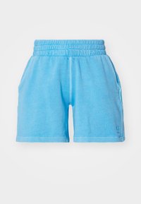 Light blue cotton shorts with elastic waistband, side pockets, and a small logo detail near the hem. Smooth texture and relaxed fit.