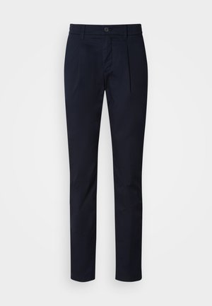 Navy blue slim fit trousers with front pleats, button and zipper closure, belt loops, and straight cut legs.