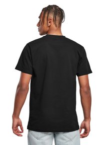 Sort kortærmet t-shirt lavet af bomuld, med rund hals og en afslappet pasform, samt en glat overflade og minimalistisk design.