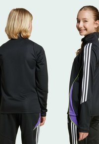 adidas Performance TIRO 24 SLIM - Donji dijelovi trenirke - black   purple rush