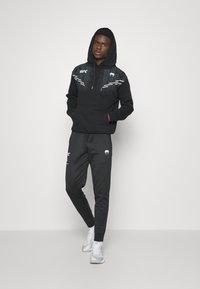 Venum UFC FIGHT NIGHT ADRENALINE JOGGERS - Træningsbukser - blue