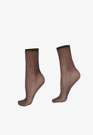 Przezroczyste brązowe skarpetki do kostki z czarnymi akcentami i ozdobnymi detalami przypominającymi ćwieki wzdłuż górnej krawędzi, o gładkiej fakturze i dopasowanym kształcie.