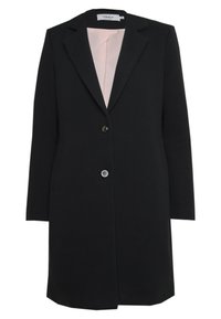 Sort lang blazer med spidse revers, enkelt knaplukning og to sidelommer. Foret med lyserødt stof for kontrast.