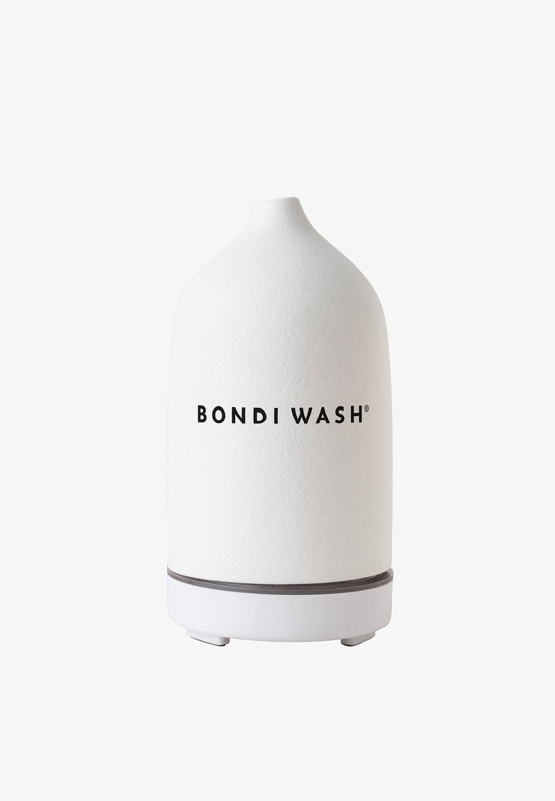 White ceramic diffuser with a rounded top, textured surface, and a gray base. Features "BONDI WASH" branding in bold black font.