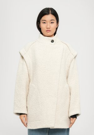 White textured coat with a high collar, featuring a single black button, oversized sleeves, and side pockets.