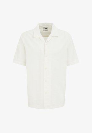 Majica s kratkimi rokavi, ki se zapira na gumbe v teksturirani beli tkanini. Ima klasičen ovratnik in pet gumbov na sprednji strani za zapiranje.