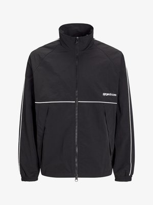 Black lightweight jacket with a high collar, front zipper, and white accent stripes on the shoulders and chest. Elastic cuffs. Logo on the chest.