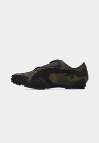 Low-profile athletic shoe in green and brown camouflage fabric with black textured sole and black logo stripe on side.