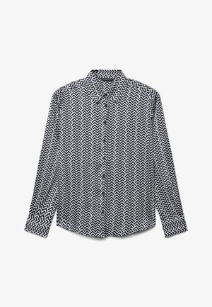 Chemise boutonnée présentant un motif zigzag noir et blanc, manches longues, col standard et ourlet arrondi.