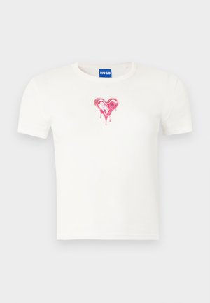 White cotton t-shirt with short sleeves featuring a red dripping heart graphic in the center, round neckline, and standard fit.