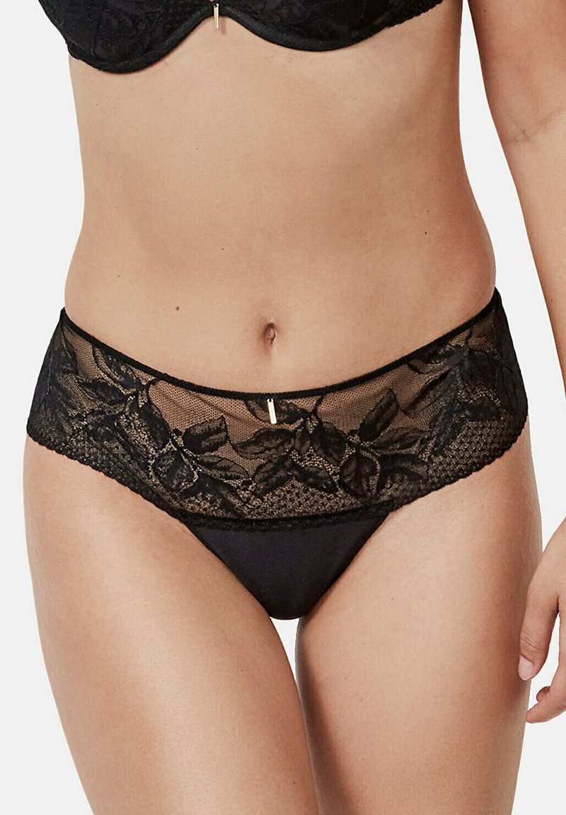 Culotte en dentelle noire avec broderie florale le long de la ceinture, présentant un tissu inférieur lisse et une délicate finition en dentelle.