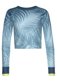 Langmouw cropped top met een blauw en grijs tropisch bladenpatroon, marineblauwe manchetten en lichtgele afwerking aan de uiteinden van de mouwen.